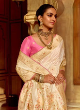 India Silk White Presents A Pure Viscose Saree Featuring A Delicately Hand-Worked Body That Showcases Exquisite Craftsmanship